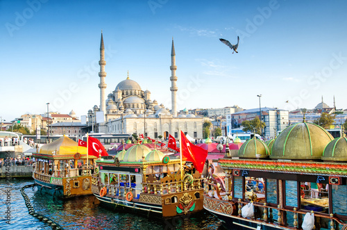 ISTANBUL, TURKEY - October 6, 2015: View of the Suleymaniye Mosque and fishing boats in Eminonu, Istanbul, Turkey
