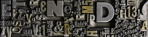 Metal Letterpress Types. A background from many historical typography letters in black and white with white background.
