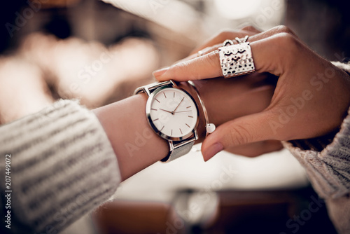 Silver watch on woman hand