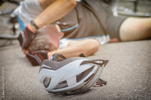 Bicycle accident, cyclist lying on the road