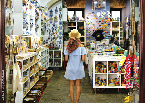 Blonde woman in souvenir shop in Lisbon, Portugal