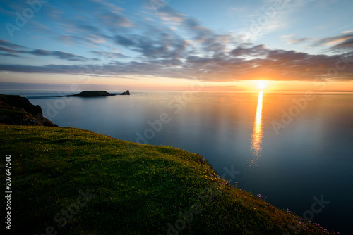 Sunset at Rhossili Bay - Rhossili Bay has been voted Wales' Best Beach many times. It is located on the west coast of Gower Peninsular
