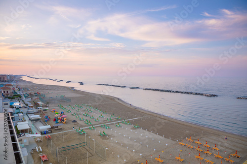 A beach in Adriatic sea in Rimini at sunset time in Italy