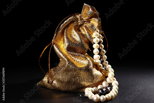 Bag made of Golden fabric with pearl beads