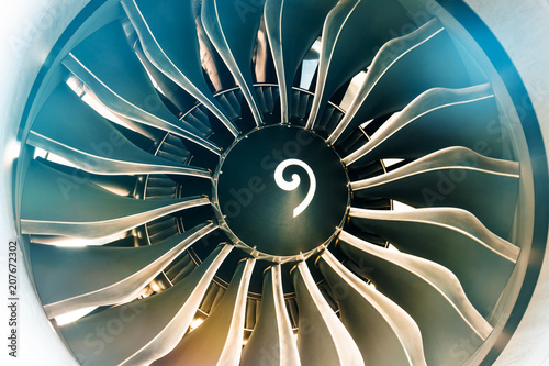 Close up of turbojet of aircraft turbine engine fan civil with a gradient of colors from cold to warm.