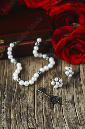 Fresh red roses with pearls