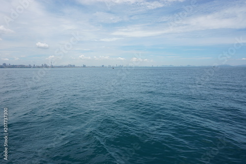 Wide angle from ferryboat look at Pattaya city in the Sea and Sky