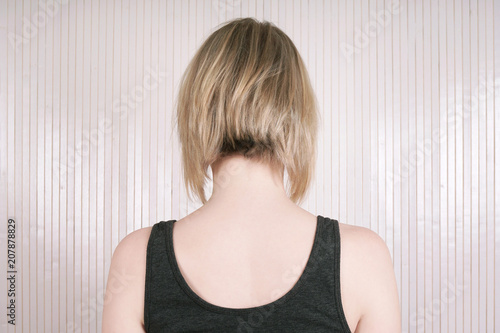 rear view of a blonde woman with lob or long bob haircut