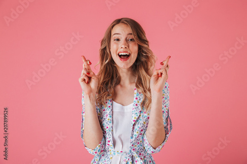 Portrait of a cheerful young woman in summer dress