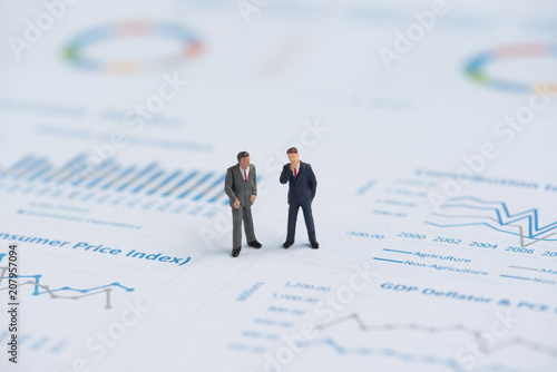 business miniature people on business graph