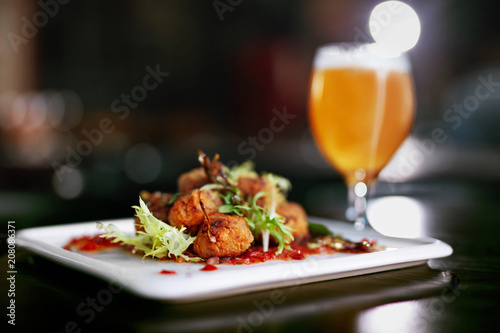 Food And Drink. Meat Rolls And Beer On Table