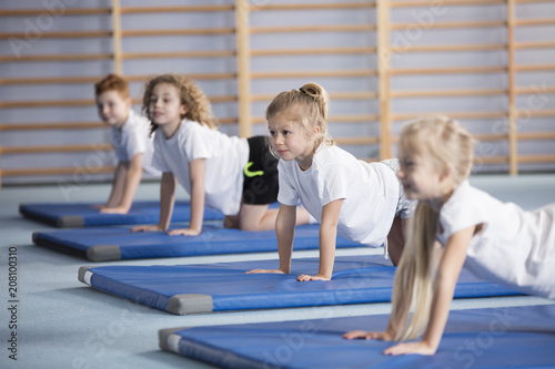 Happy girl during corrective gymnastics