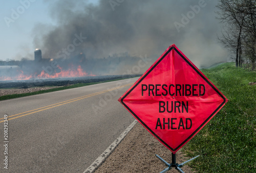 Prescribed Agricultural Burn Area and Sign: A sign warns motorists of a controlled burn area ahead on a farm in southern Wisconsin. 