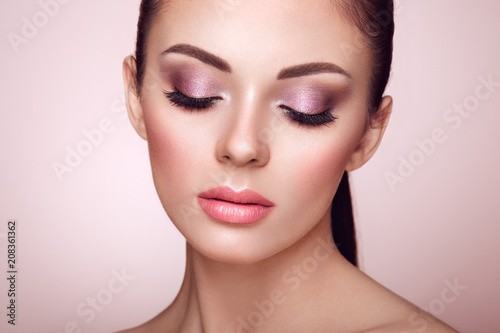 Beautiful Young Woman with Clean Fresh Skin. Perfect Makeup. Beauty Fashion. Eyelashes. Cosmetic Eyeshadow. Highlighting. Cosmetology, Beauty and Spa