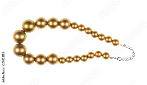 necklace of gold pearls on white isolated background