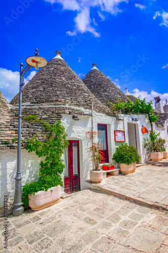Alberobello, Puglia, Italy: Typical houses built with dry stone walls and conical roofs, in a beautiful day, Apulia