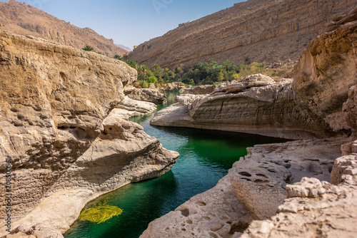 the refreshing cold water of the oasis of Wadi Bani Khalid in Oman