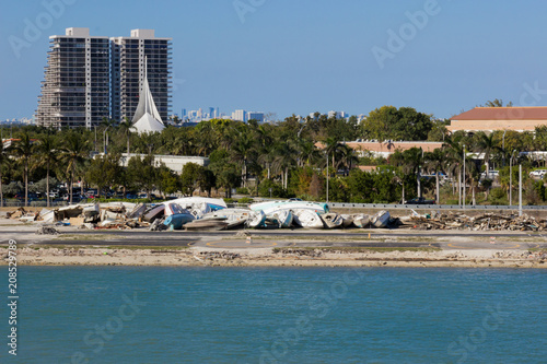 Brocken yachts along the canal in Miami. Effects of hurricane Irma