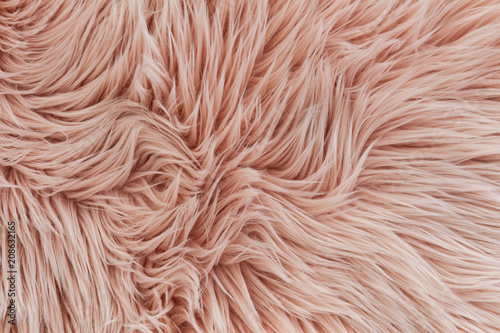 Pink synthetic fluffy fur texture background