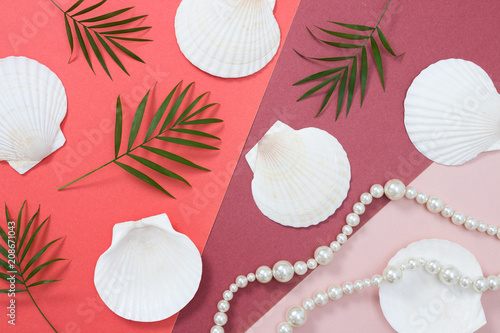 Tropical flat lay with seashells and pearls