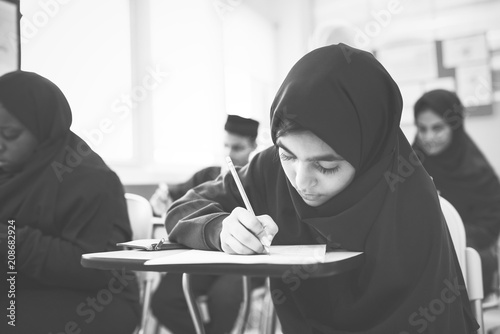 Muslim children studying in a classroom