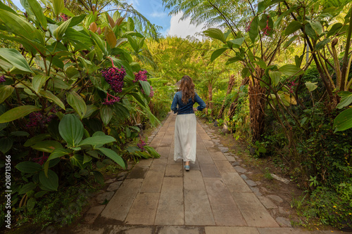 Girl walking trough a botanical garden in Hell-Bourg, Reunion Island