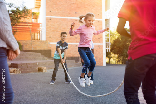 Children playing with skipping rope