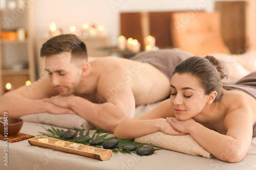 Young couple relaxing in spa salon