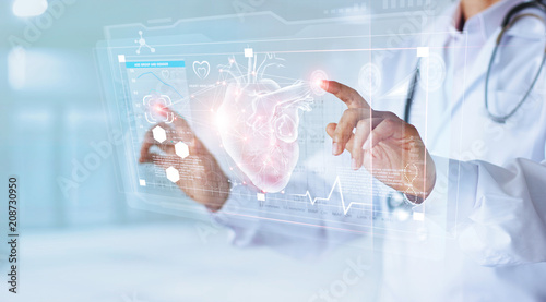 Medicine doctor with stethoscope touching icon heart and diagnostics analysis medical on modern virtual screen interface network connection. Medical technology diagnostics of heart concept