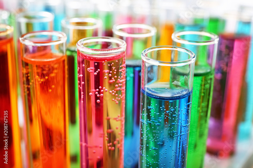 Many test tubes with colorful liquids, closeup