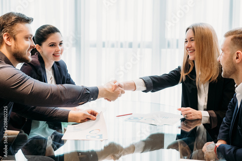 closing or sealing a deal. business partners shaking hands. cooperation partnership, trust joint venture concept