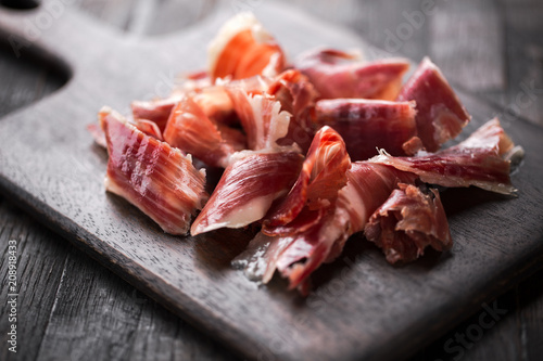 Traditional Spanish Jamon Serrano ham, Prosciutto Crudo, Parma ham, Italian antipasto.