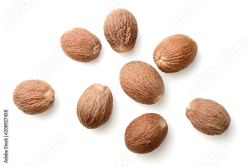 dried nutmeg isolated on white, top view