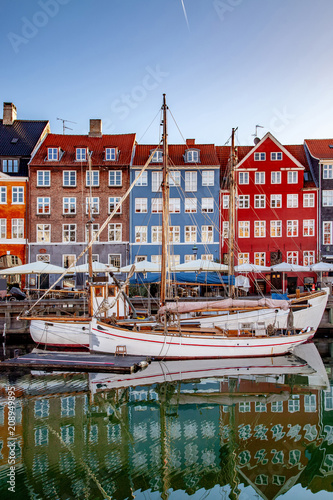 COPENHAGEN, DENMARK - MAY 6, 2018: boats and beautiful historical buildings reflected in calm water, copenhagen, denmark