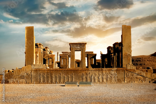 Sunrise in Persepolis, capital of the ancient Achaemenid kingdom. Ancient columns. Sight of Iran. Ancient Persia. Beautiful sunrise background.