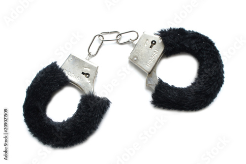 Handcuffs with fur on white background. Accessory for love games. black. 