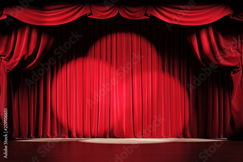 Theater stage with red velvet curtains with spotlights