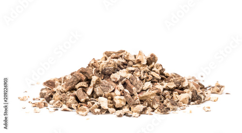 Organic dried dandelion root pile isolated on white background