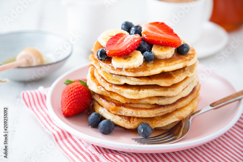 Homemade pancakes with berries and banana