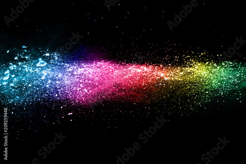 Multicolor powder explosion on black background. 