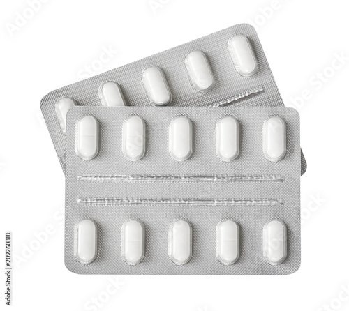 Silver blister packs pills isolated on white background