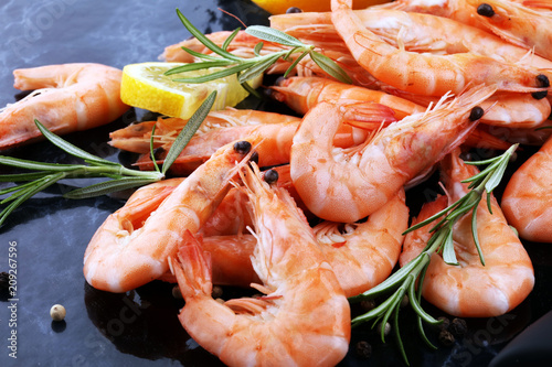 Raw fresh Prawns Langostino Austral. shrimp seafood with lemon and spices.