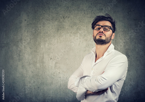 Overconfident stylish man in glasses