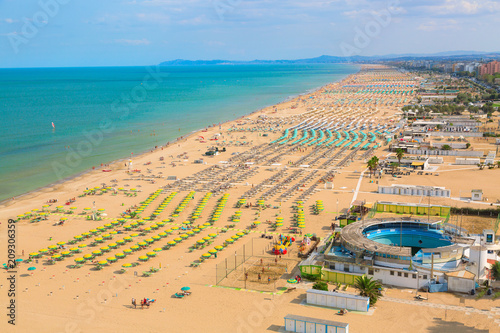 Aerial view of Rimini beach with people and blue water. Summer vacation concept.