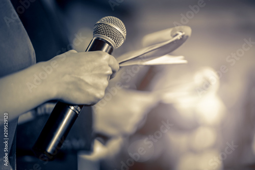 Master of ceremonies with microphone on stage