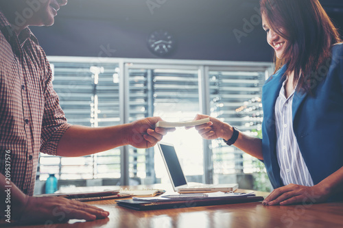 business partners signing contract to borrow money from investor to invest at own business