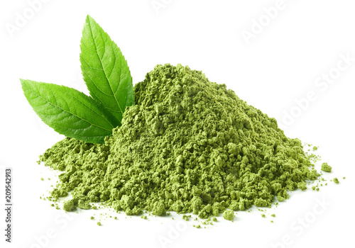 Heap of green matcha tea powder and leaves