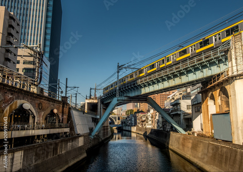 Tokyo train crossing a bridge over the Kanda river near Akihabara.