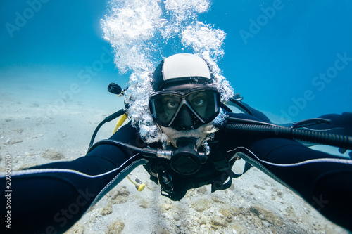 Scuba diver self portrait underwater