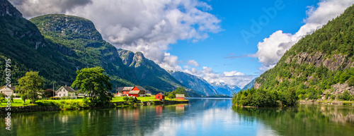 Amazing nature view with fjord and mountains. Beautiful reflection. Location: Scandinavian Mountains, Norway. Artistic picture. Beauty world. The feeling of complete freedom